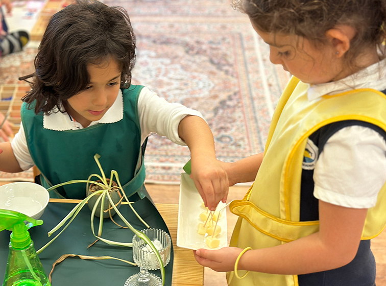Child sharing sensorial materials in Montessori classroom