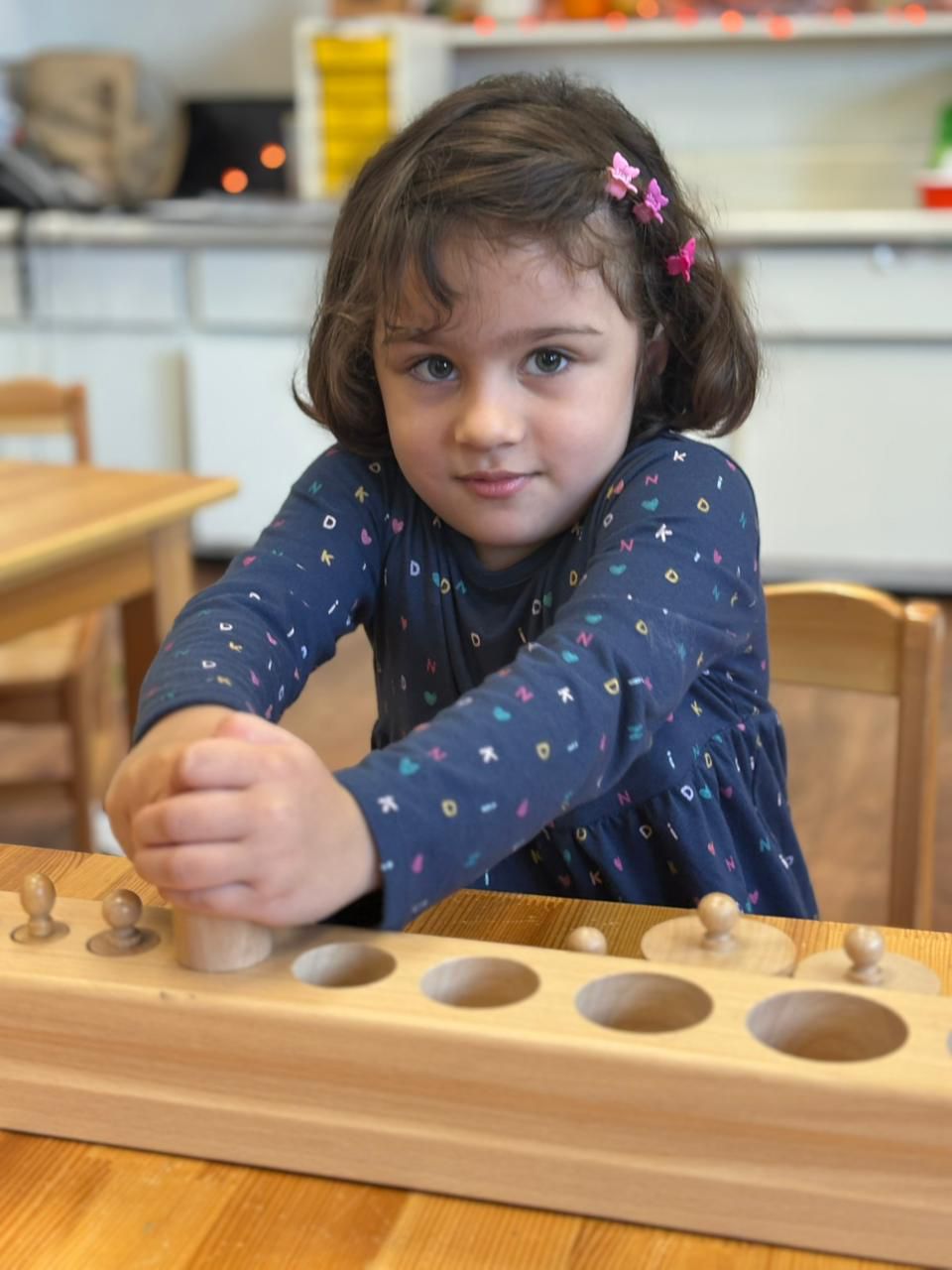 Montessori-girl-sensorial-activity 1