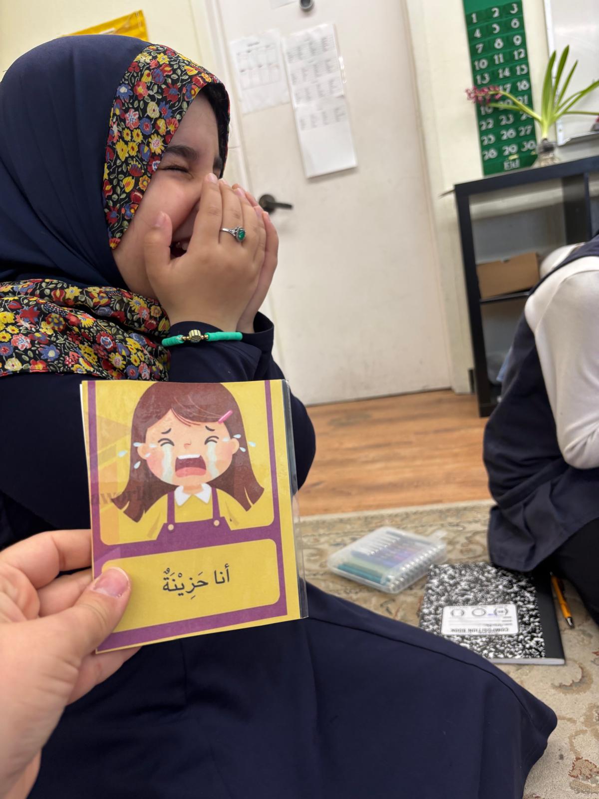Child tracing sandpaper letters in Montessori language lesson