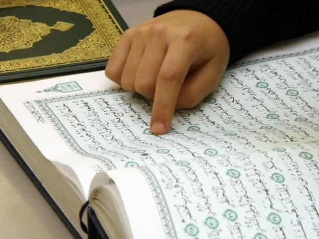 Students engaging in Islamic ethics discussion and Quran study